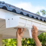 A close-up photo of gutter guards installed on a roof to prevent debris buildup and water overflow.