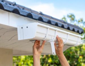 A close-up photo of gutter guards installed on a roof to prevent debris buildup and water overflow.