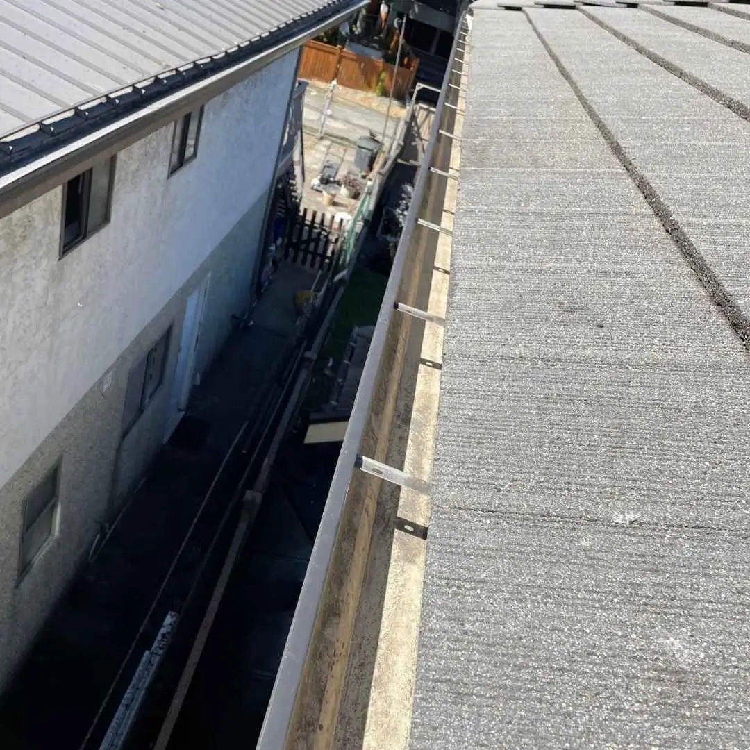 Close-up of roof edge and gutter installation.