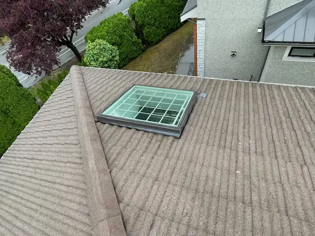 Residential roof with skylight window view